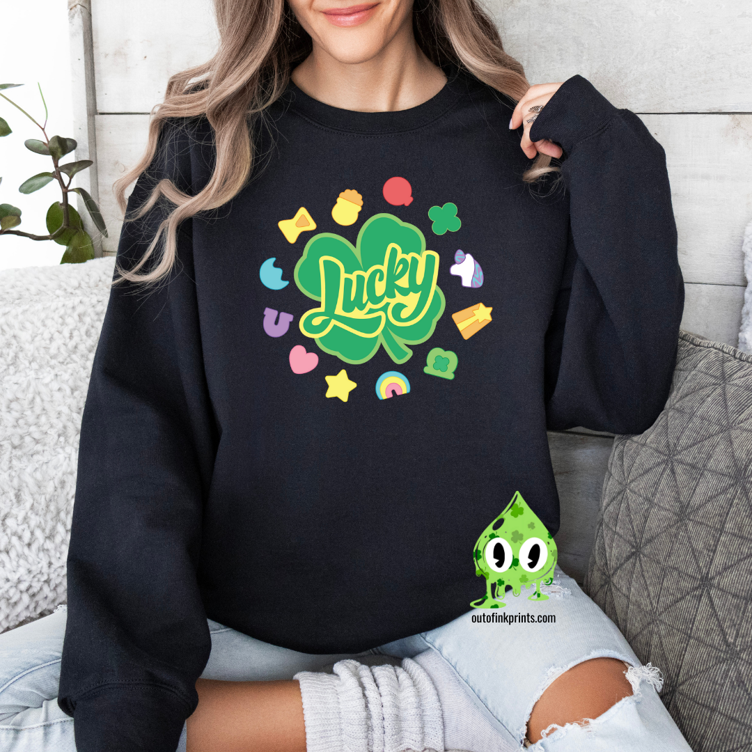 Front view of a black sweatshirt with a graphic that includes the text 'Lucky' and various colorful shapes like stars and hearts.