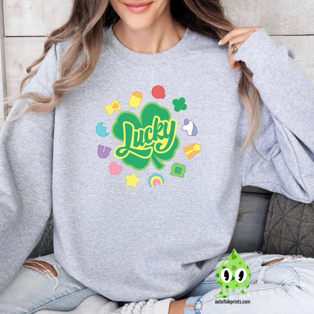 Front view of a gray sweatshirt with a graphic that includes the text 'Lucky' and various colorful shapes like stars and hearts.