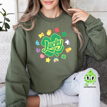 Front view of a green sweatshirt with a graphic that includes the text 'Lucky' and various colorful shapes like stars and hearts.