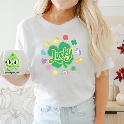 Front view of a white t-shirt with the text 'Lucky Marshmallows' and various colorful graphic elements.