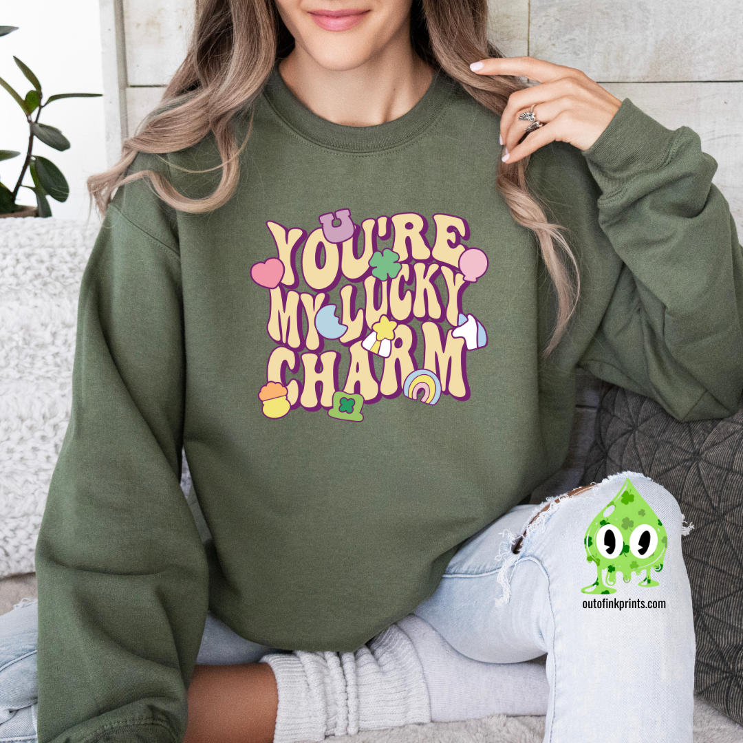 Front view of a green sweatshirt with the text 'YOU'RE MY LUCKY CHARM' printed on the front.