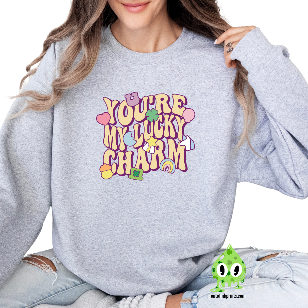 Front view of a gray sweatshirt with the text 'YOU'RE MY LUCKY CHARM' printed on the front.